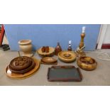 A box of assorted teak and beech table lamps, bowls, etc.