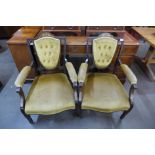 A pair of Edward VII inlaid mahogany and upholstered open armchairs