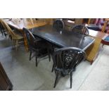 A dark oak refectory table and four chairs