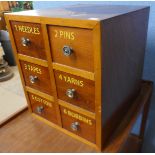 A beech six drawer counter top haberdashery cabinet, bearing Clark & Co, Anchor Mills inscription