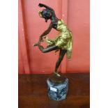 An Art Deco style gilt bronze figure of a dancing girl, on green marble socle, 50cms h