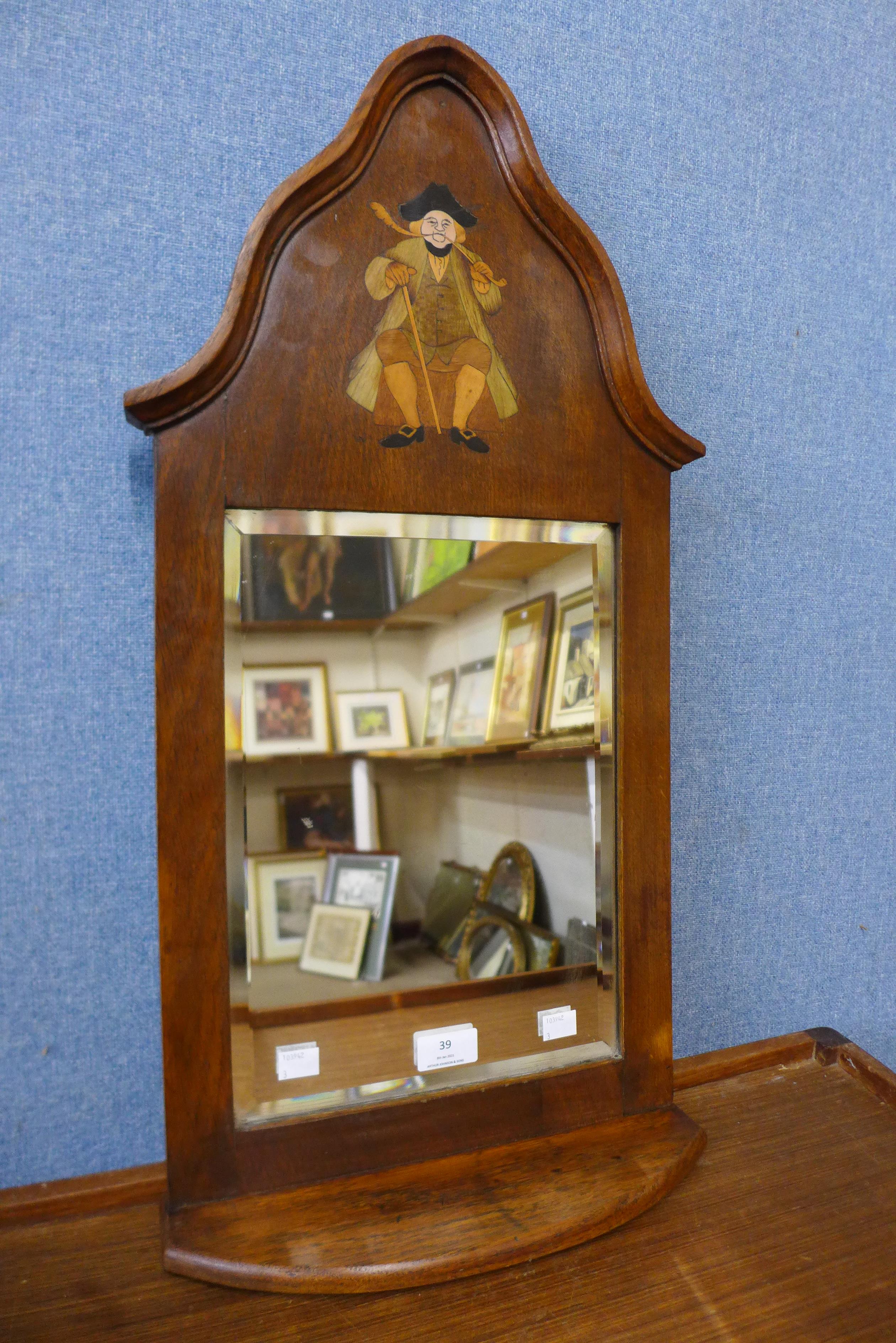 An Arts and Crafts inlaid oak hall mirror, attributed to Liberty & Co., 69cms h