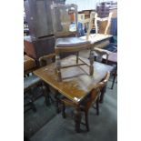 An oak draw-leaf table and four chairs
