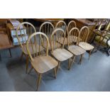 A set of eight Ercol Blonde Windsor chairs, one a/f