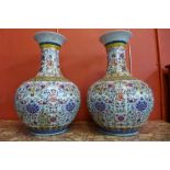 A pair of Chinese famille juane bulbous porcelain vases, 55cms h