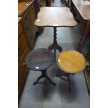 A Victorian style walnut tilt-top tripod table and two mahogany wine tables