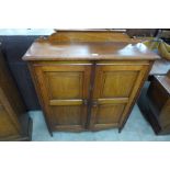 A Victorian walnut two door cupboard