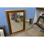 A black and gilt framed mirror and one other