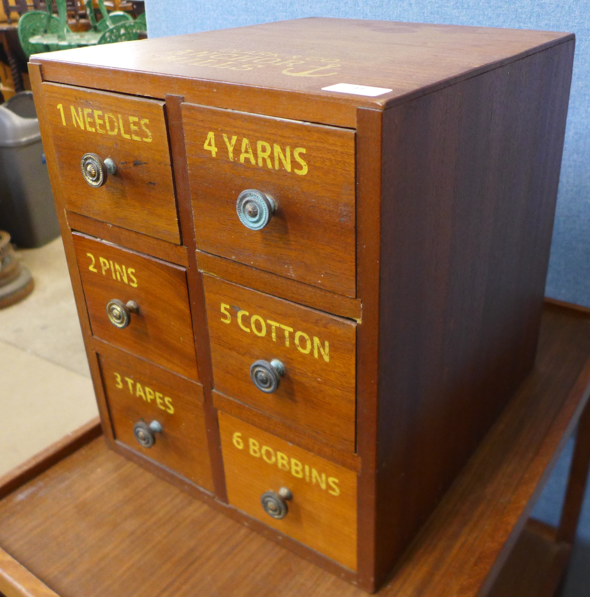 A beech six drawer counter top haberdashery cabinet, bearing Clark & Co, Anchor Mills inscription
