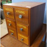 A beech six drawer counter top haberdashery cabinet, bearing Clark & Co, Anchor Mills inscription