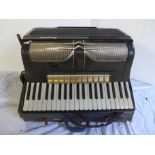 A Sorrento accordion and case