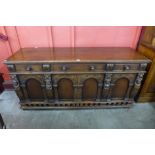 An Elizabethan Revival carved oak sideboard, 85cms h, 179cms w, 56cms d