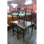 A Younger teak extending dining table and four chairs