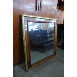 A Victorian walnut and parcel gilt framed mirror, 87 x 78cms