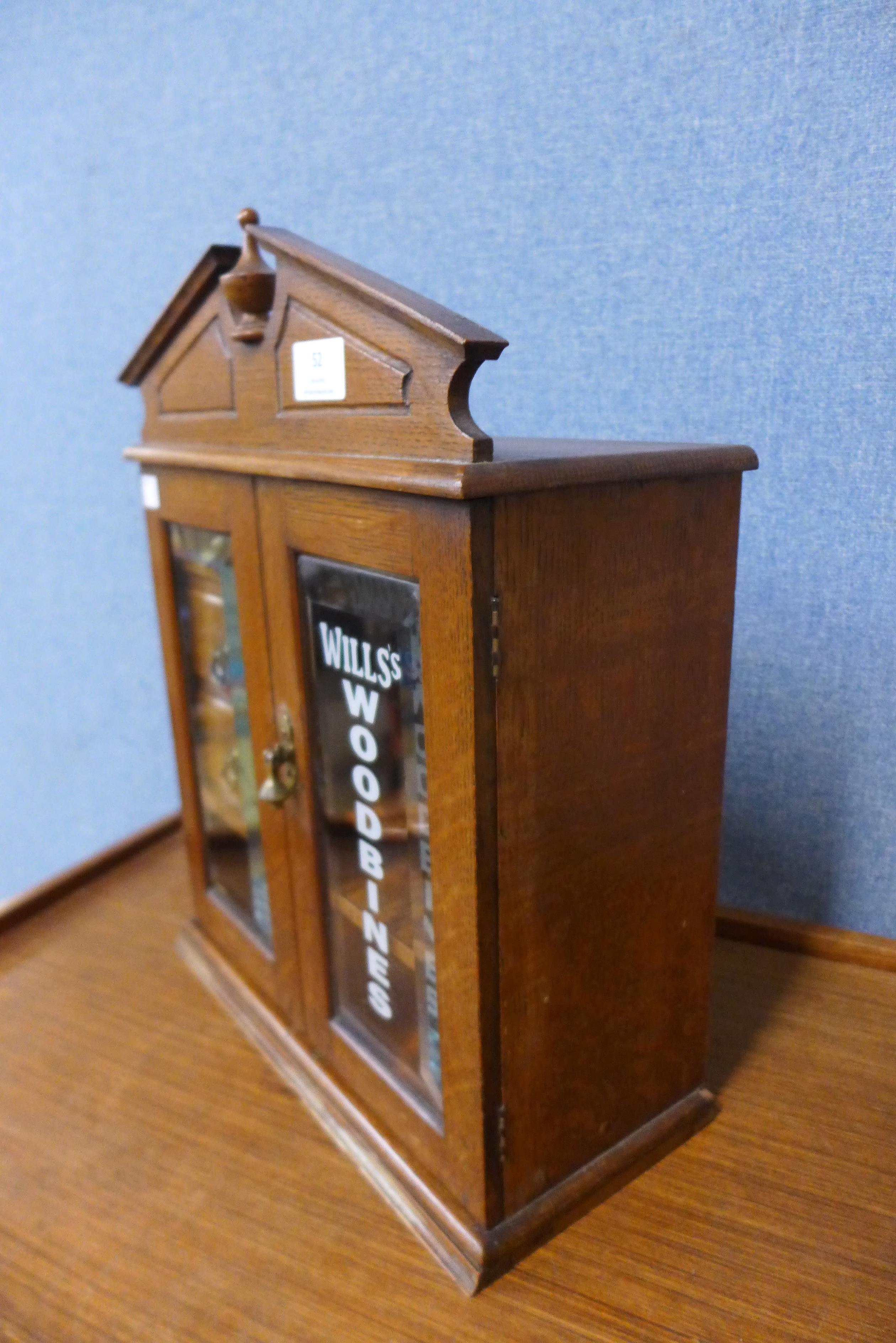 An oak smokers cabinet, bearing Wills Woodbines inscription - Image 3 of 3