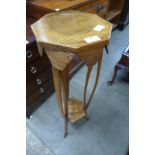 An Arts and Crafts oak jardiniere stand