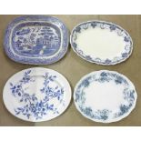 A large blue and white Willow pattern meat plate and three other meat plates, a/f