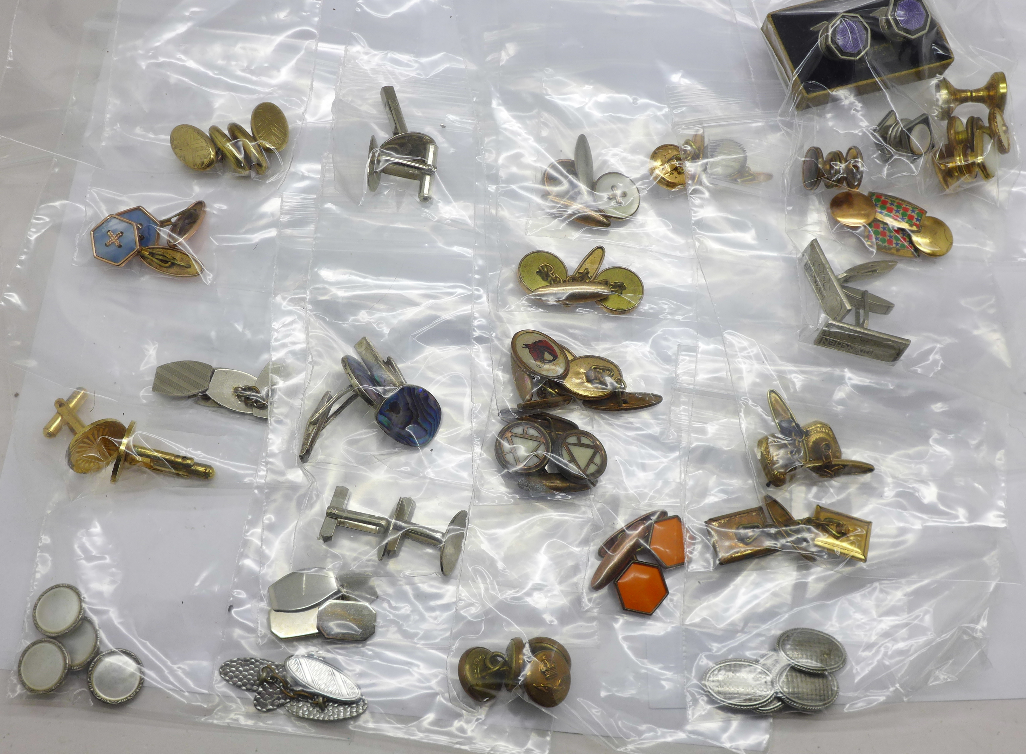 A collection of cufflinks and studs/buttons