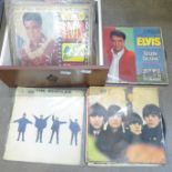 A collection of LP records including The Beatles and Elvis Presley