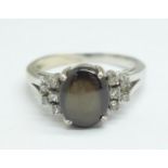 An 18ct white gold, cats eye stone and diamond ring, 5.4g, U