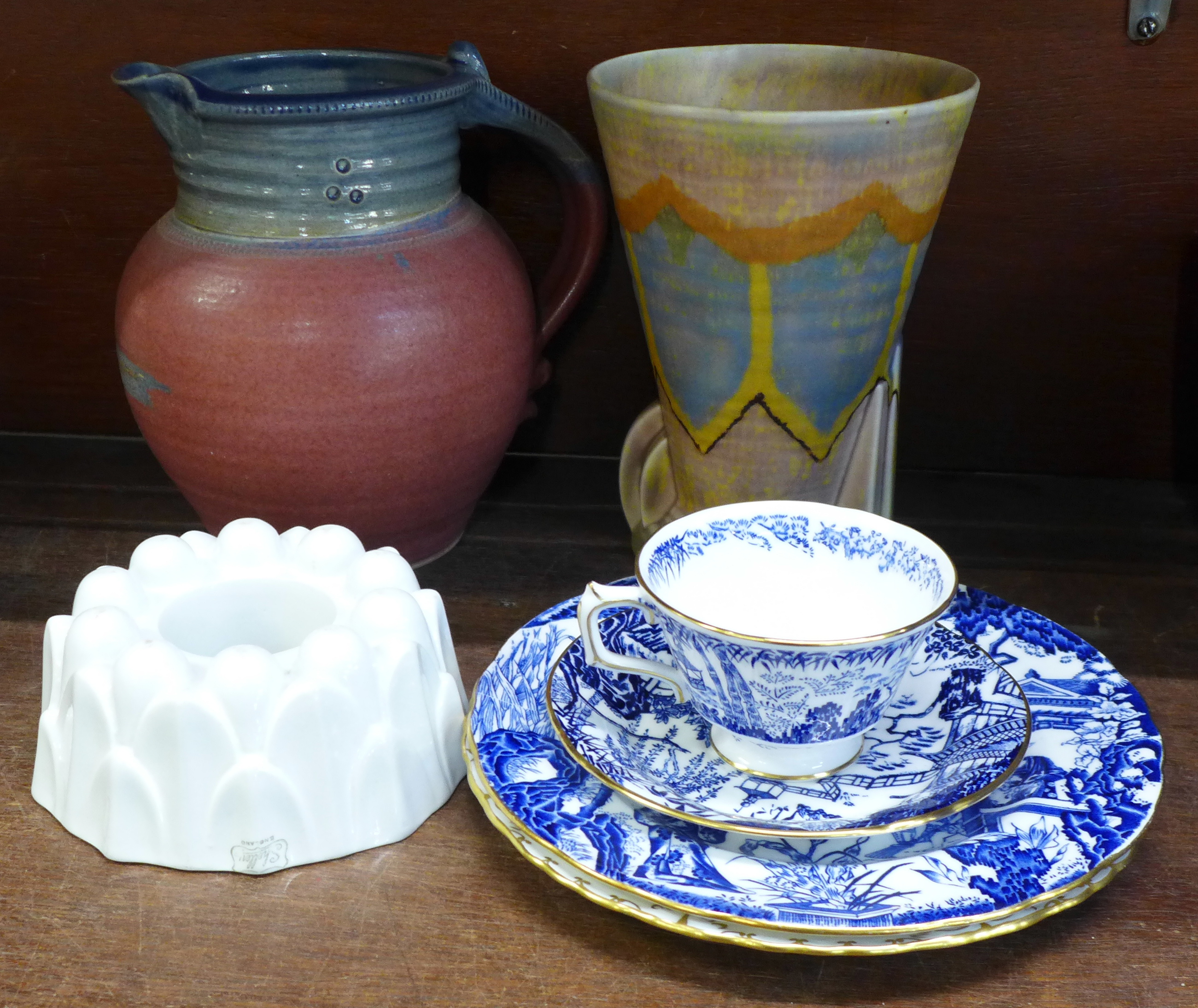 An Art Deco vase, a St. Agnes Pottery stoneware jug, a Shelley jelly mould and four items of Royal