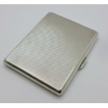 An Art Deco silver cigarette case, London 1933 inscribed 'World Petroleum Congress, London 1933',