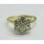 An 18ct gold and diamond cluster ring, 0.75carat diamond weight, 2.7g, J