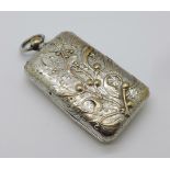An Art Nouveau coin holder with embossed case