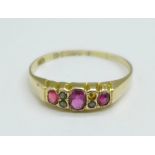 A 9ct gold, ruby and pearl ring, Chester hallmark, c.1910, worn date letter, lacking one seed pearl,