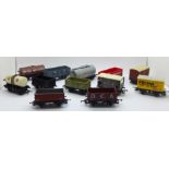 Twelve OO gauge model railway wagons including Hornby and Mainline