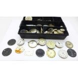 A collection of watch movements and dials