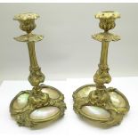 A pair of 19th Century French ormolu candlesticks, each set with three shells, 19.5cm