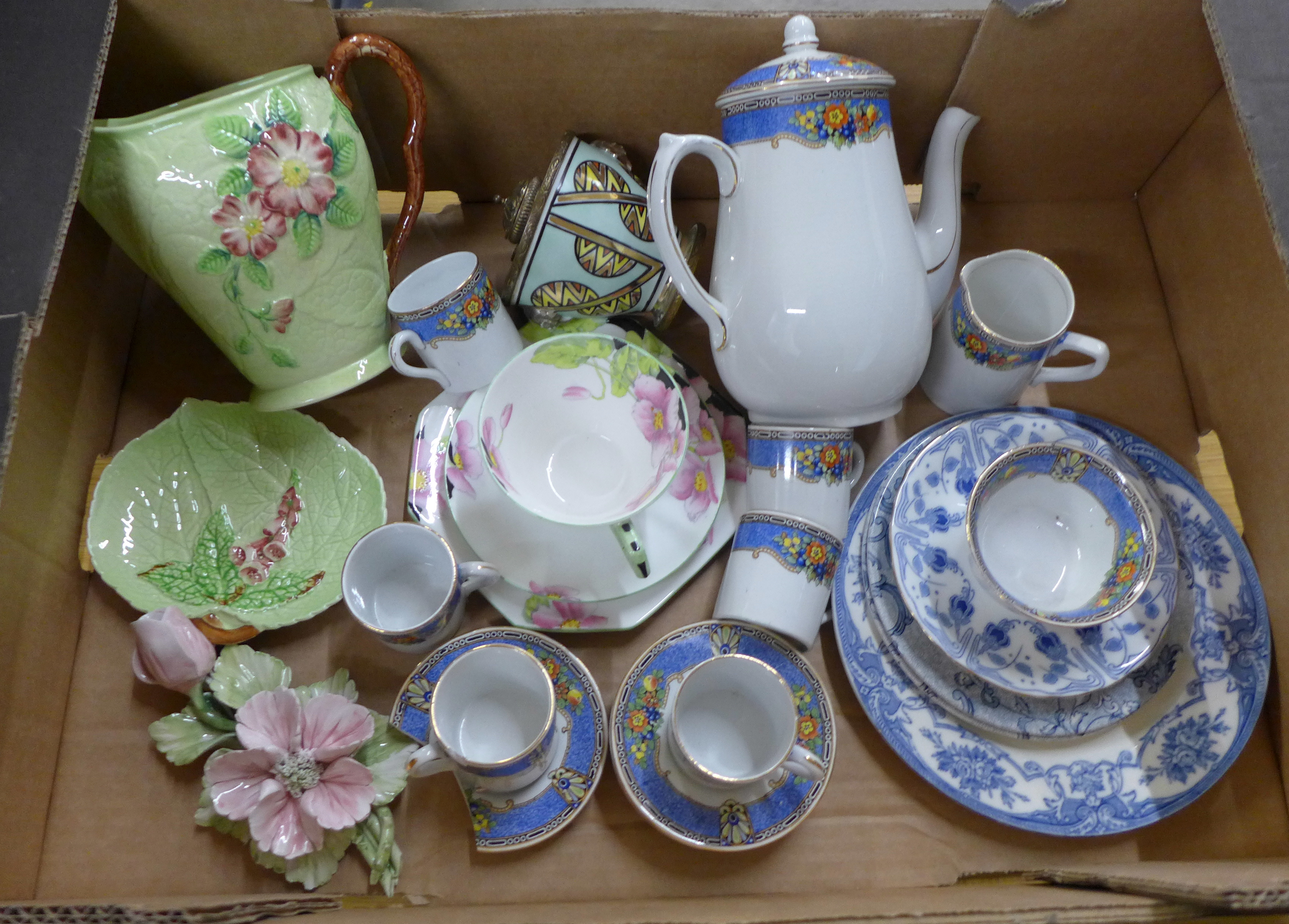 A Carlton Ware jug and dish, a porcelain ink pot with metal lid, a Paragon trio, a coffee service,