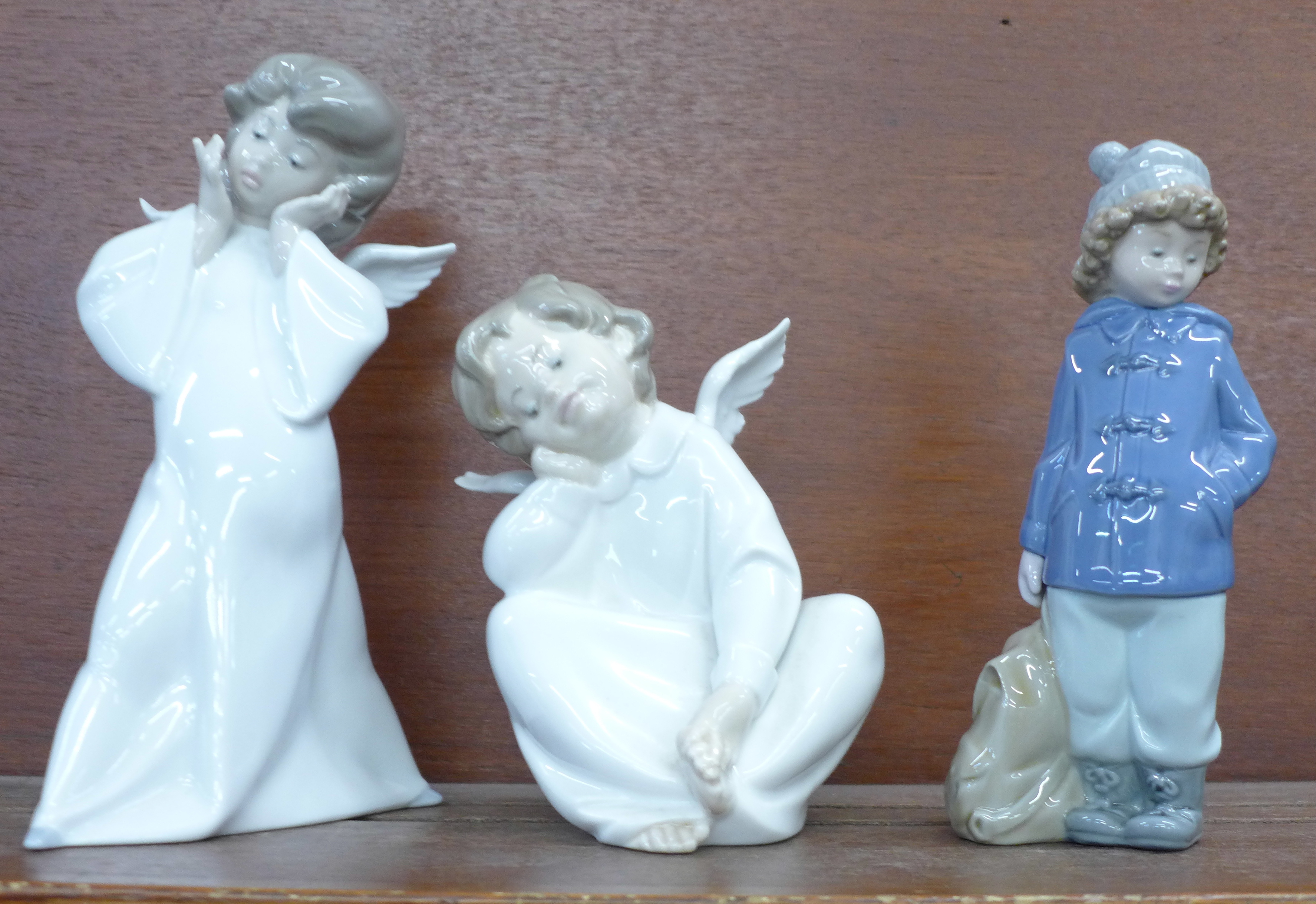 Two Lladro figures and a Nao by Lladro figure