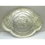 A plated dressing table tray with Reynolds angels, marked J.C. & Co. Ltd., 30cm