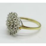 A 9ct gold, thirty-seven diamond cluster ring, 1carat diamond weight, 3.2g, O