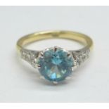 A 9ct gold and zircon solitaire ring with diamond shoulders, 2.9g, L