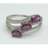 A 9ct white gold, magenta garnet and white sapphire ring, 3.5g, S