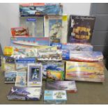 Three boxes of model kits including Revell Shelby GT, Spitfire and Queen Mary, Heller, Airfix and