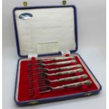 Six silver handled cake forks, cased