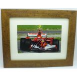 A framed signed photograph of Michael Schumacher