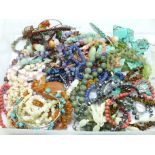A collection of gemstone jewellery including coral, opalite, rock crystal, etc.