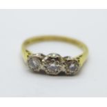 An 18ct gold, three stone diamond ring, 3.2g, R