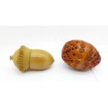 A carved pomander and an acorn shaped thimble holder