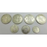 Seven coins; four half-crowns, 1926, 1928, 1936 and 1939, two shillings, 1944 and 1945 and a 1943