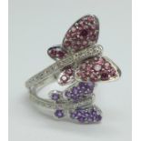 A 9ct white gold butterfly design cocktail ring set with 25 diamonds, 26 rubies and 16 amethysts,