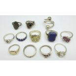 Twelve silver rings including one heart shaped set with a diamond and one dolphin, (one lacking