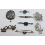 Five silver brooches including a peacock and a marcasite set leaf and three other brooches, (8)