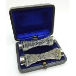 A pair of cut glass and silver knife rests, boxed, Birmingham 1901