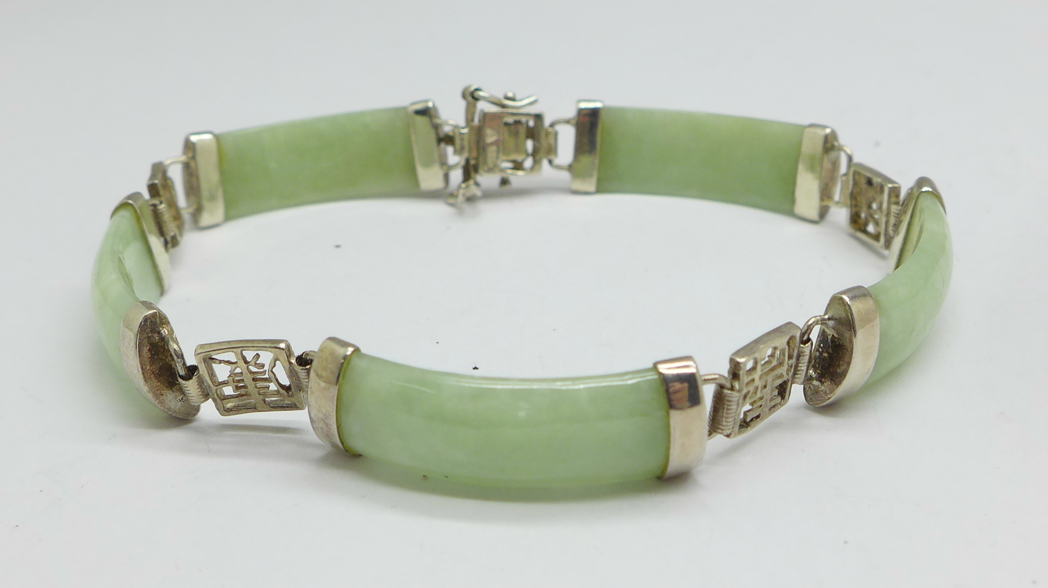 A silver and jade bracelet